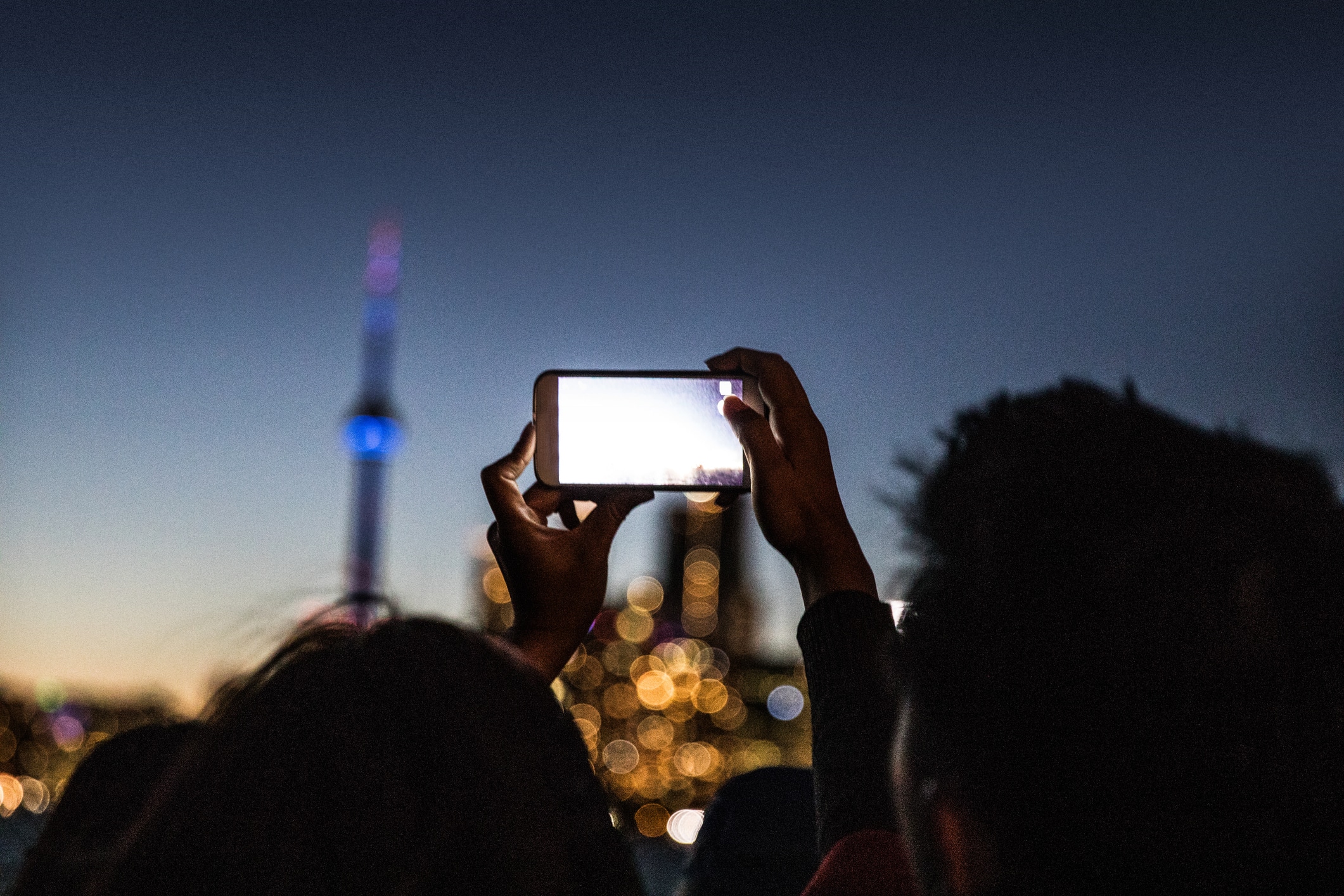 People photographing the beautiful Toronto skyline at night